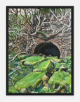 Framed artwork of a stone tunnel with greenery
