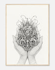 Framed artwork of hands holding a detailed floral design on a white background