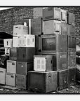 Art print of a photo of a stack of old electronic equipment against a brick wall