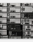 Framed wall art of black and white electronic components on a white background