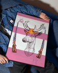 Person holding a framed artwork of a deer with a pink background