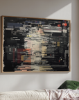 Framed abstract artwork on a wall above a sofa