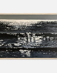 Framed artwork of sparkly ocean surface with reflections on a white background