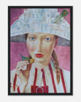 Framed artwork of a woman with a hat and a cherry, on a pink background
