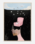 Framed artwork of a woman with a pink chair on her head against a starry night sky.