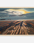 Framed artwork of Welsh landscape with a sunset over the horizon.