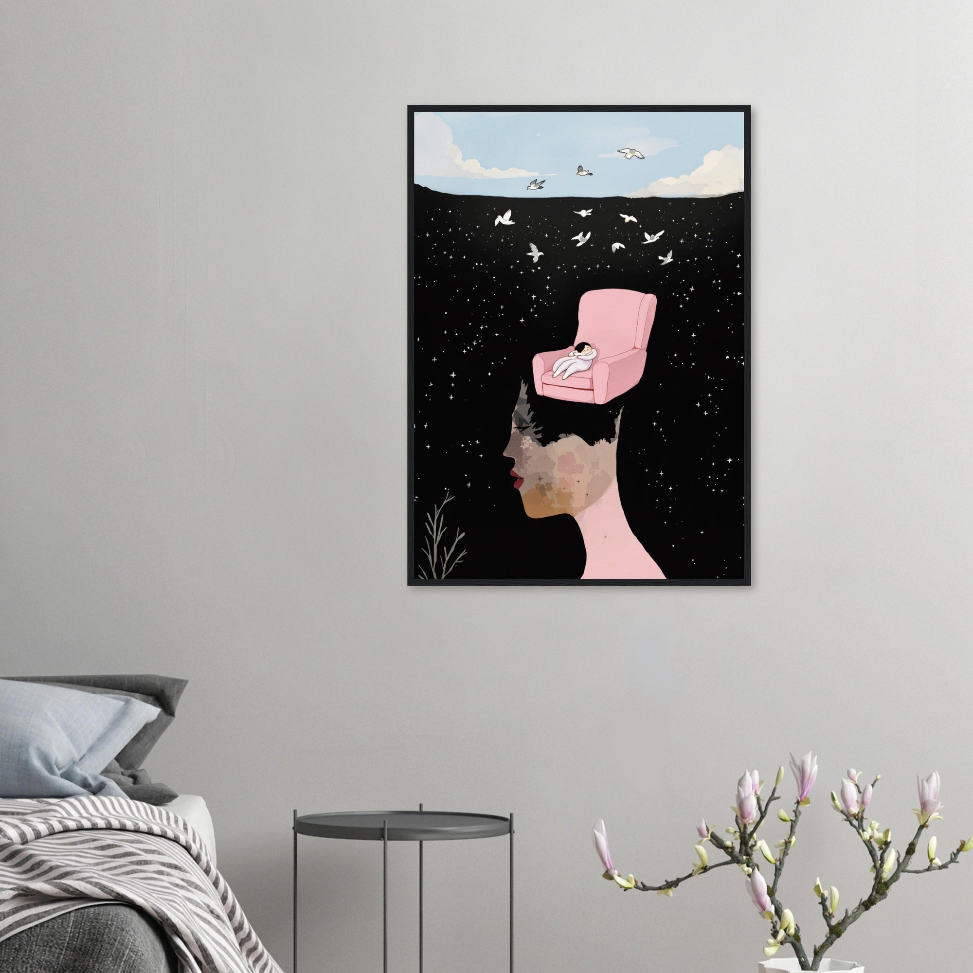 Framed artwork of a woman with a pink chair on her head against a starry night sky, hanging on a wall.