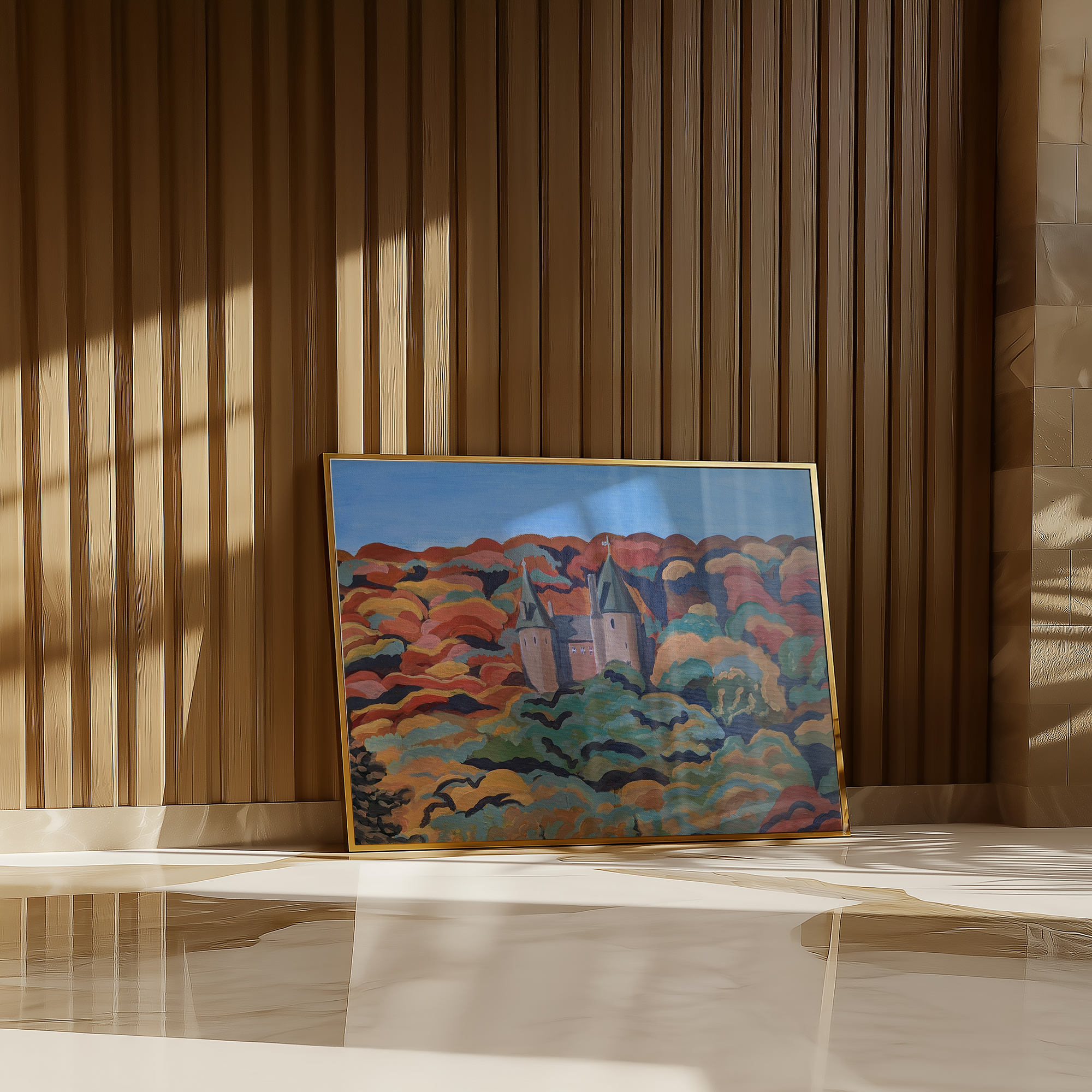 Framed painting of a landscape with a castle on a wooden wall.