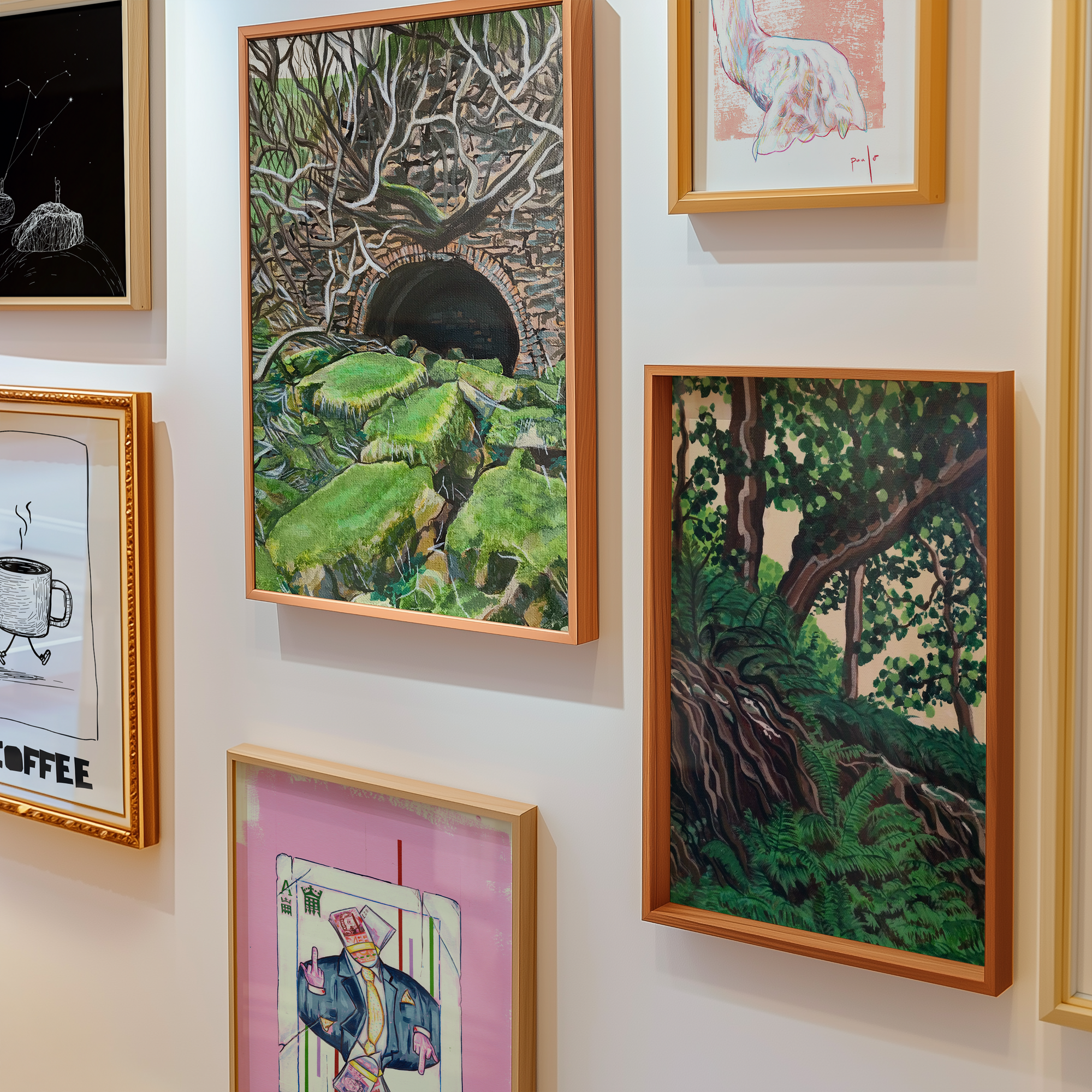 Gallery wall of different portrait framed wall art prints