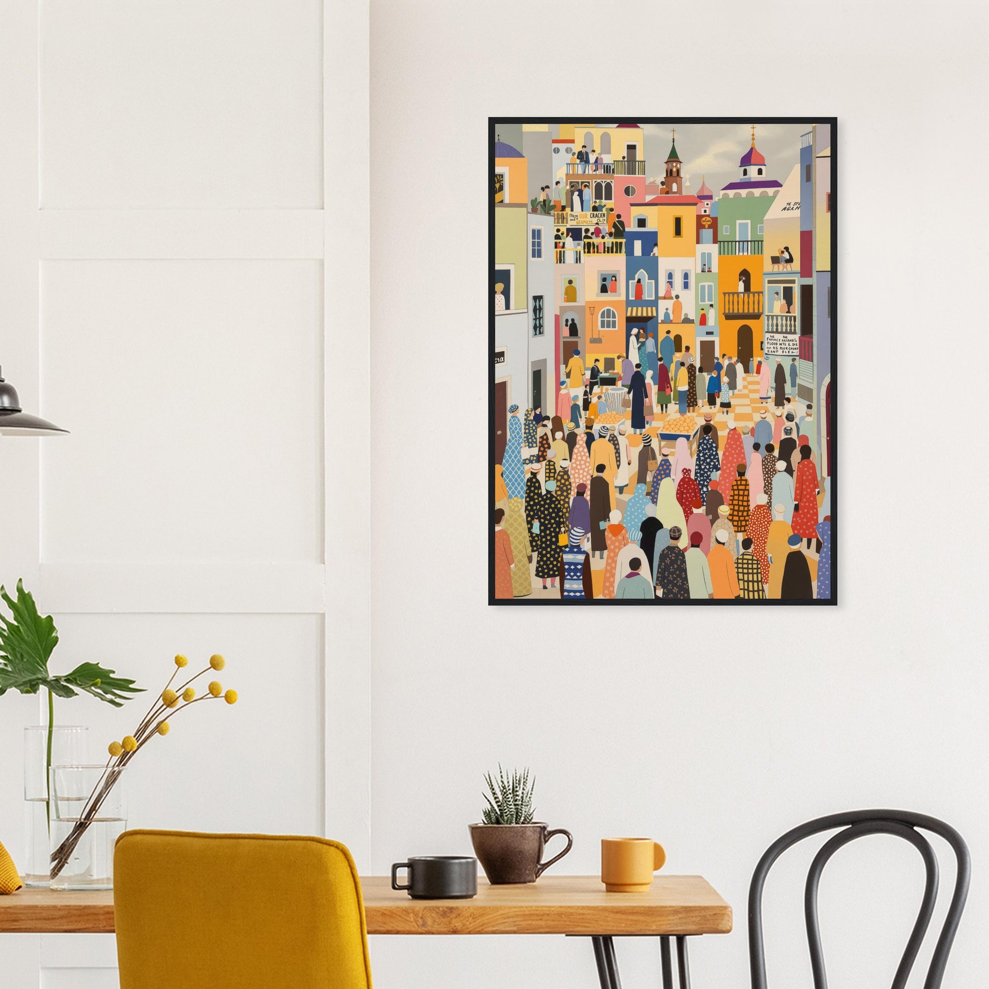 Colorful abstract art print on a white wall above a wooden table with chairs.