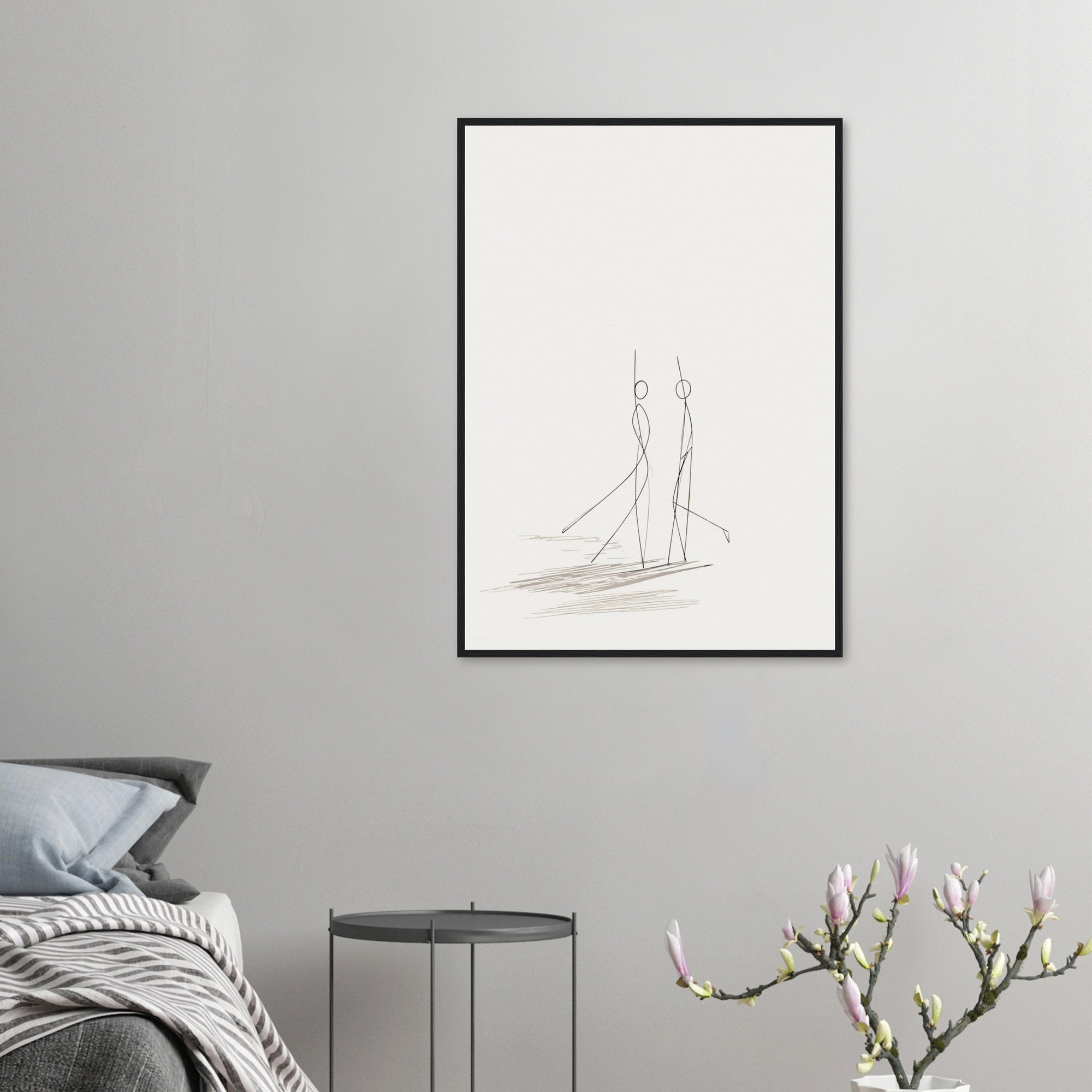 Framed wedding artwork of a happy couple dancing, hanging on a grey bedroom