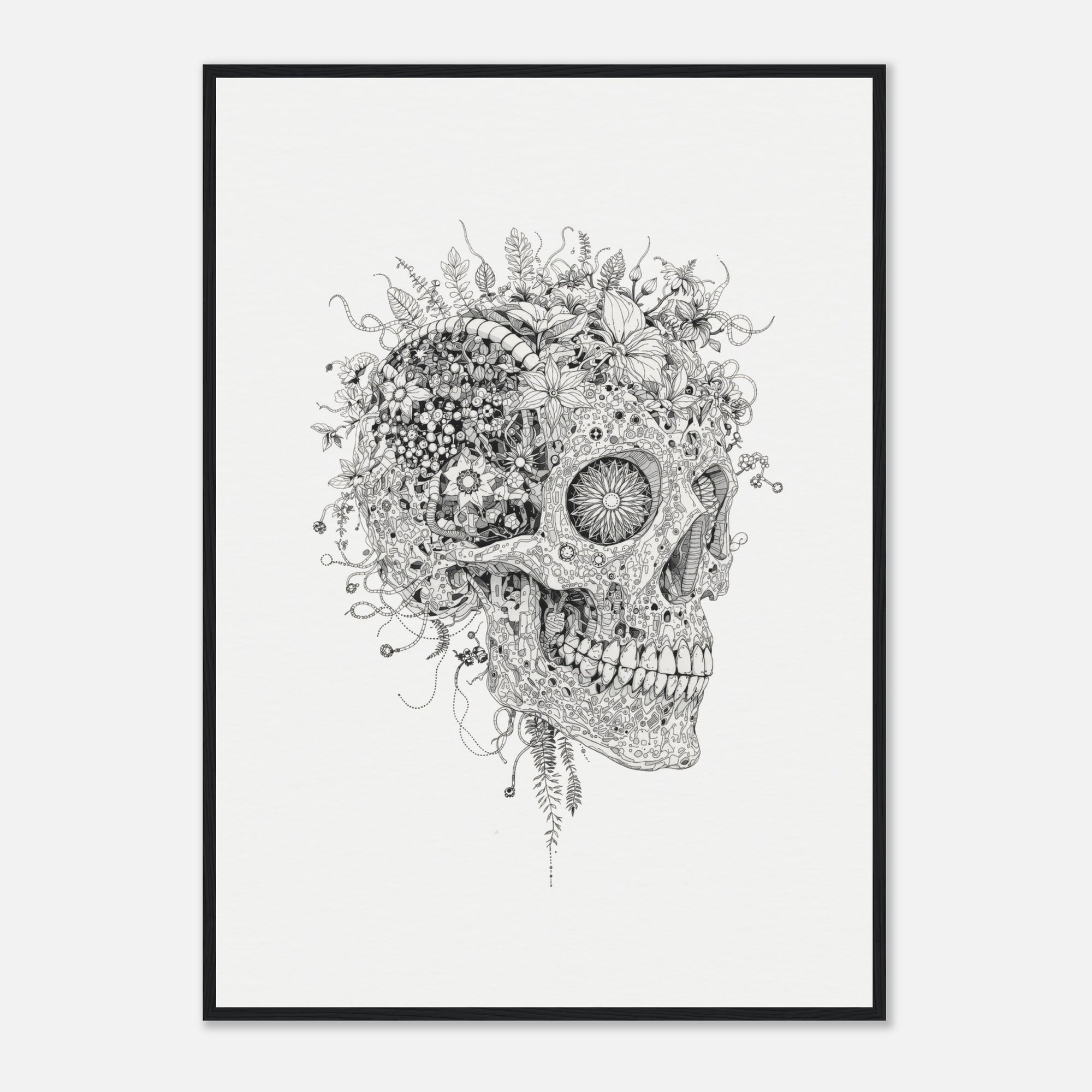 Framed artwork of a skull with flowers and plants growing out of it on a white wall.