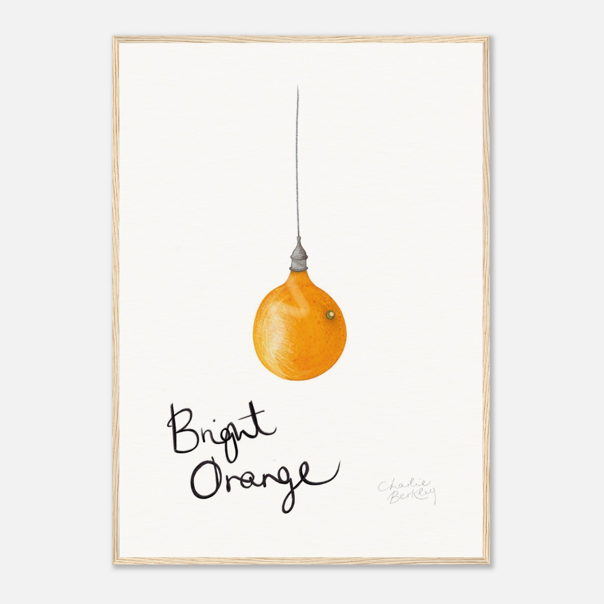 Framed artwork of a bright orange light bulb with &#39;Bright Orange&#39; text on a white background in a wood frame