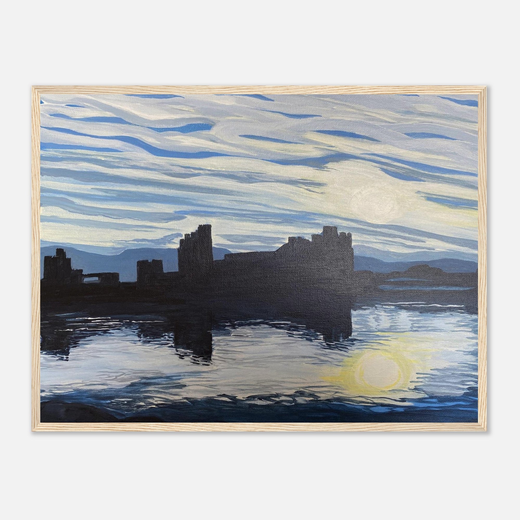 Framed artwork of caerphilly castle by a body of water with a blue sky.