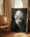 Framed portrait of a woman in a room with a chair and vintage decor.