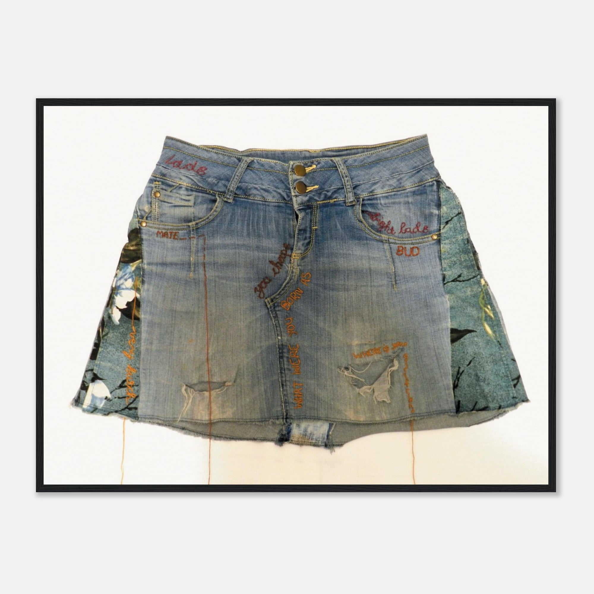 Framed art print of a denim skirt on a white background