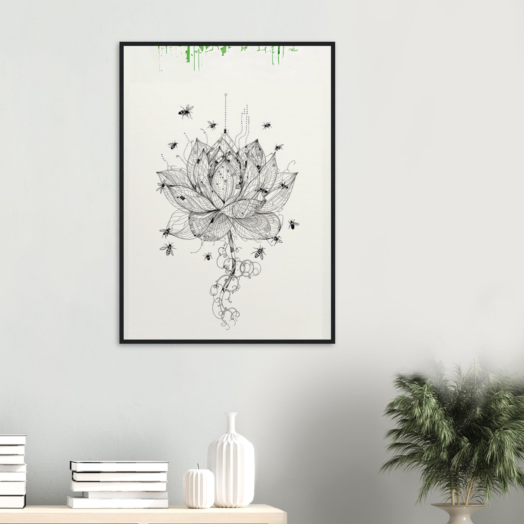 Framed artwork of a black and white lotus flower with green accents on a light gray wall in a living room.