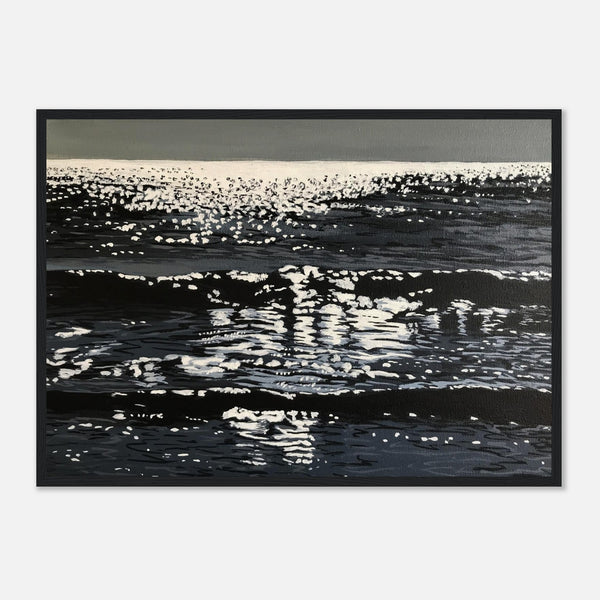 Framed artwork of ocean surface with reflections on a white background