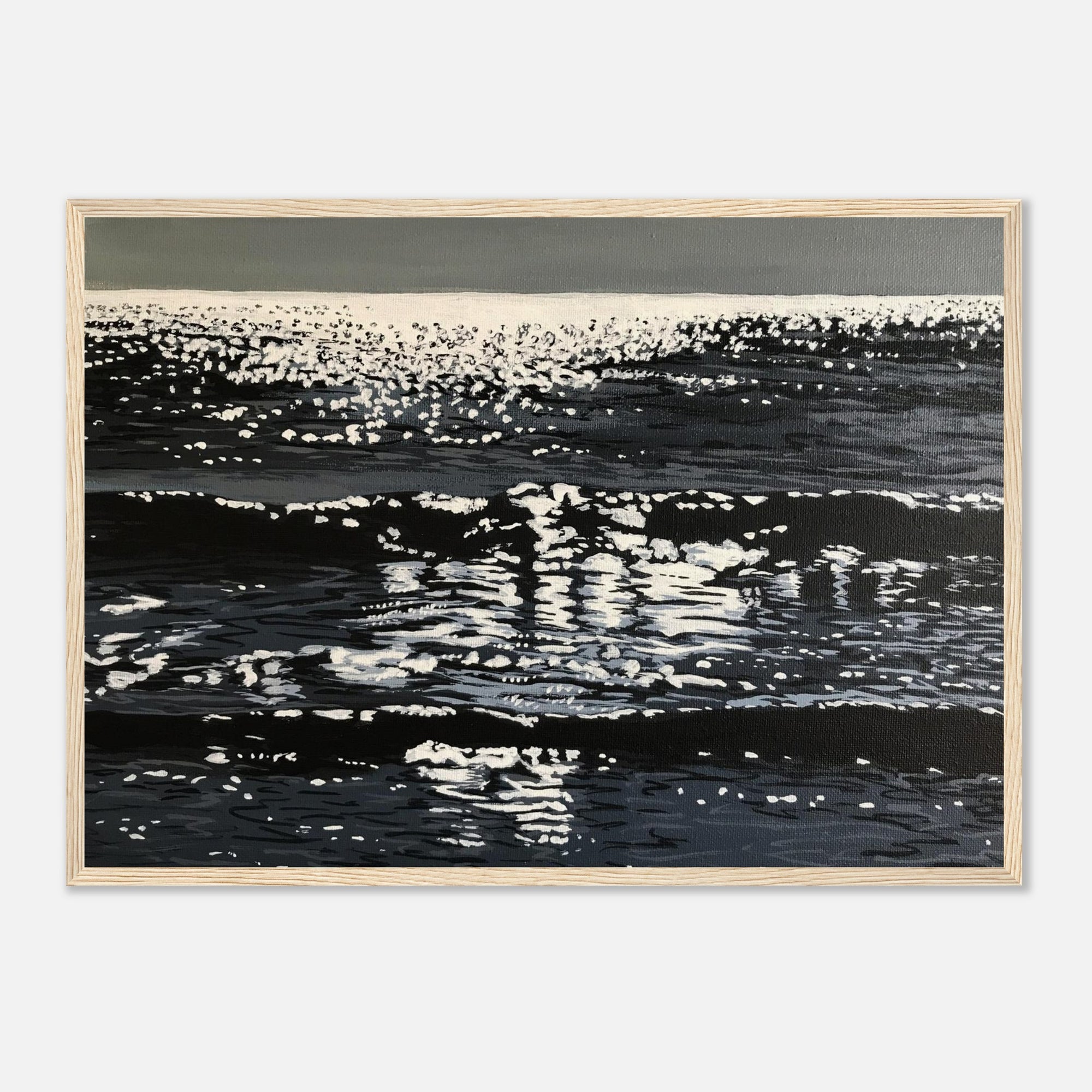 Framed artwork of sparkly ocean surface with reflections on a white background