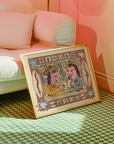 Framed artwork of two characters with a pink couch and green checkered floor in the background